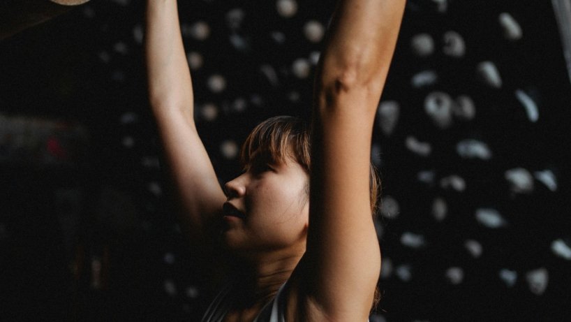 Photo by Allan Mas: https://www.pexels.com/photo/fit-asian-mountaineer-grabbing-climbing-holds-during-practice-5383525/