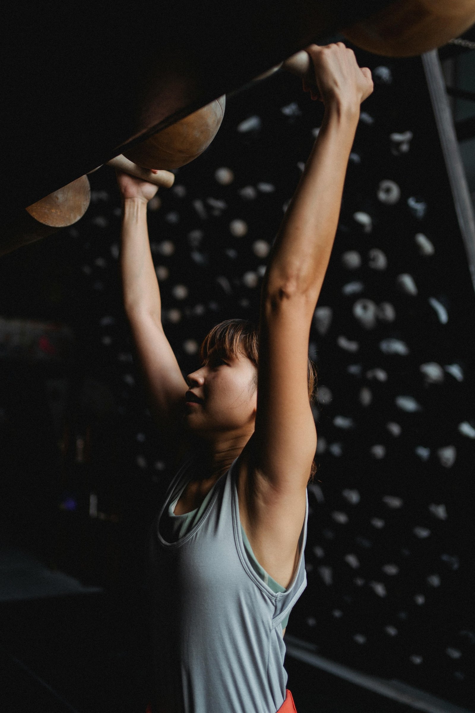 Photo by Allan Mas: https://www.pexels.com/photo/fit-asian-mountaineer-grabbing-climbing-holds-during-practice-5383525/